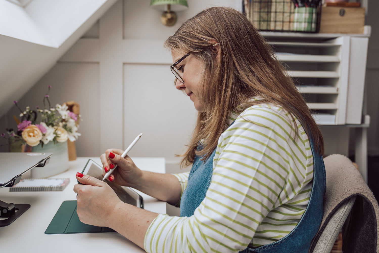 Surrey Illustrator at work at desk